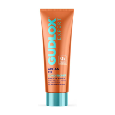 Argan Oil Conditioner being applied to nourish dry, dehydrated hair Argan Oil Conditioner being applied to nourish dry, dehydrated hair